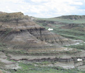 Photo of mountains and arrows indicating coal beds containing volcanic ash