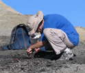Geologist with a sample, on a mountain