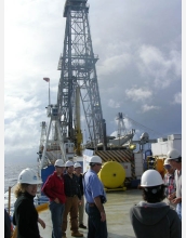 Scientists drill into ocean crust from aboard the vessel JOIDES Resolution.