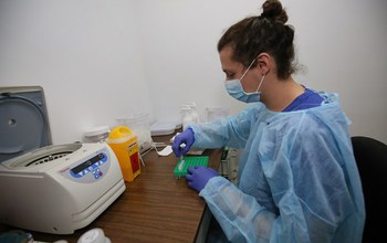 Scientists working with samples in a lab