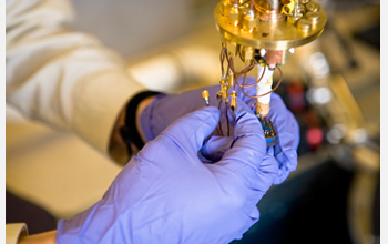 Photo shows equipment used to trap one or two electrons in microscopic corrals.