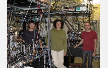 Photo of James Chou, Daniel Felantro and Hugues de Riedmatten in their entanglement lab at Caltech.