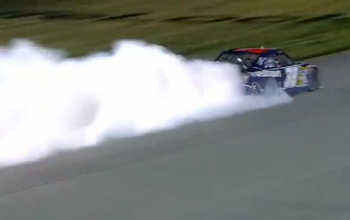 racecar tires smoking on a track