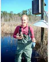 Graduate student Sarah DuRant weighs a female wood duck at a field site in South Carolina