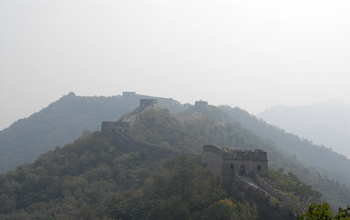 Photo of Great Wall of China near Beijing obscured by air pollution, dust and sand.