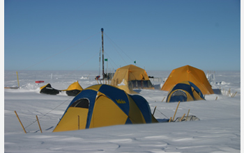 Photo of tents and the drilling rig in Greenland.