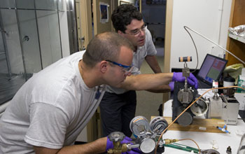Sean Sylva (left) and Jeff Seewald extracting a sample.