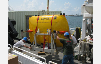 Autonomous underwater vehicle (AUV) Sentry is loaded onto the research vessel Endeavor.