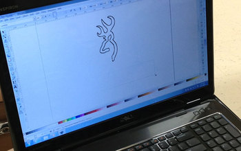Laptop shwoing a cover design created by students