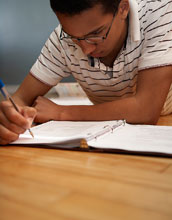 Photo of a young man studying.