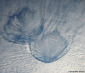 Clouds in the shape of hole-punches in the skies above Wisconsin.