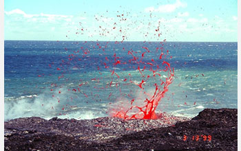 Photo showing lava splattering near the coastal entry of Kilauea.