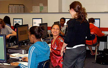 Photo of Julia Barnathan assisting a student with a lesson