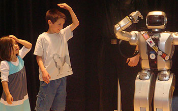 Two kids and robot Jaemi HUBO playing Simon Says.