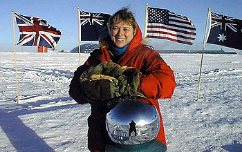Physician Jerri Nielsen at the ceremonial South Pole marker.