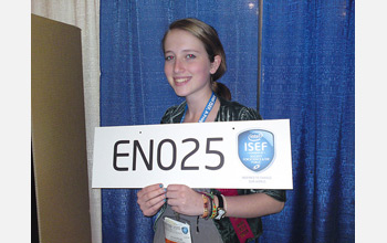 Julia Poje, at this year's Intel International Science and Engineering Fair, holding a sign.