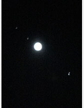 Jupiter and three of its moons