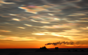 Nacreous clouds enhance a dramatic sunrise at McMurdo Station