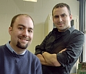 Andrew Greenberg and Mohammed Farhoud pose with their enlarged, 3-D model of a nanoscale structure.