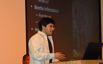 Photo of Raphael Perea delivering a presentation.