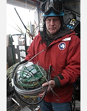 Robert Paulos holds one of the optical sensing modules.