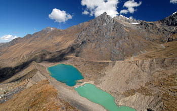 Photo of lakes impounded behind an inner glacial moraine in a valley in Peru.