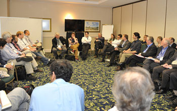 Poeple sitting in a circle at the NSF's BRAIN workshop