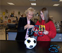 Photo of science teacher Jeanine Gelhaus discussing nanostructures with a student.