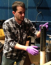 Scientist Blair Paul prepares a sediment core for further sampling