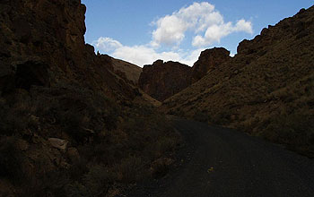 underexposed image of desert road