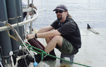 Photo of biologist Jeff Morris on a research vessel.