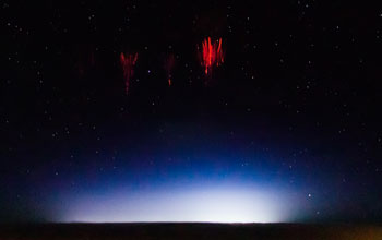Sky with red sprites resembling glowing jellyfish