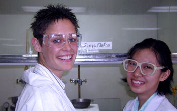 Summer undergraduate researcher in lab in Thailand.