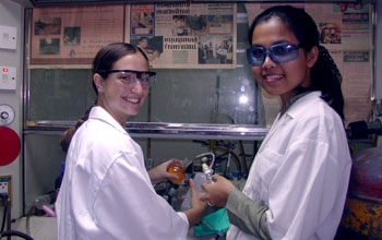 Summer undergraduate researcher working in lab in Thailand.