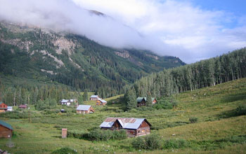Photo of Gothic Mountain shrouded in clouds behind Colorado's Rocky Mountain Biological Laboratory.