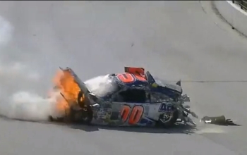 Race car on fire and smoking