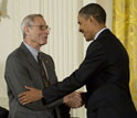 Photo of Michael Posner receiving the National Medal of Science from President Barack Obama.