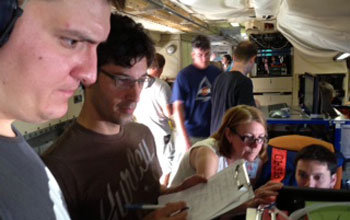 Researchers on a research plane with instruments
