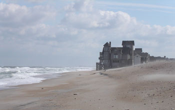 Photo of rising seas lapping at a house in the film Nights in Rodanthe.