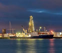 Photo of the night view of the JOIDES Resolution, docked in Auckland, New Zealand.