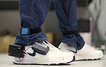 running shoes with electronic device attached