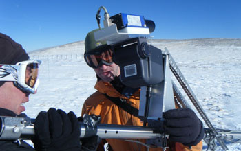 a scientist field-testing new instrumentation to accurately measure snow.