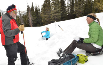 Scientist Mark Williams samples snow with help from Katya Hafich and Kendall Gotthelf.