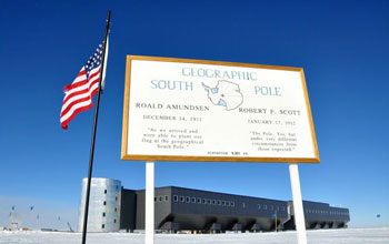 a sign at the geographic South Pole located at 90 degrees south latitude.