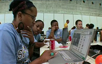 Several students and laptop computers