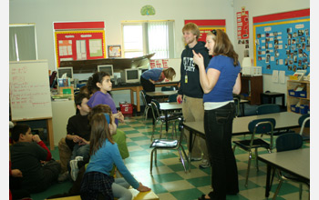 Photo of STOMP fellows teaching students an engineering project.