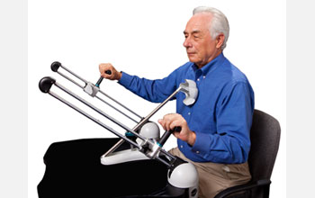 Photo of Jim White demonstrating the use of the Tailwind device.