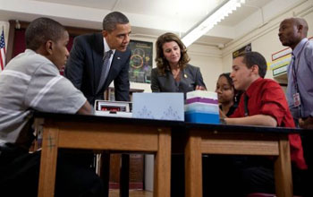 Photo of President Obama, Melinda Gates, James Louis, who hosted the president, and students.