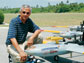 Photo of V. Ramanathan with several autonomous unmanned aerial vehicles.