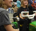 Photo of a young girl riding a robocar.